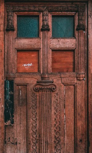 A symmetric shot of an old weathered wooden door